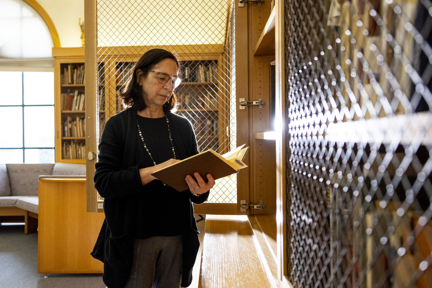 Janice Braun stands in the Heller Rare Book Room at F. W. Olin Library